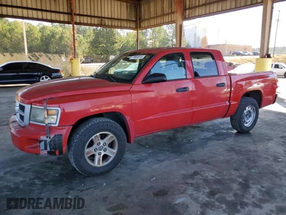 2010 Dodge Dakota Bighorn/Lonestar z VIN 1D7CE3GK9AS163619, wystawiony jako Copart lot #77604814 z przebiegiem 187 461 mil mil oraz Czysty tytuł • Clean title. Historia ofert i sprzedaży dostępna na DreamBid. Obrazek 1.