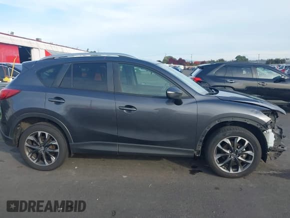 ✅ 2016 Mazda CX-5 Grand Touring • VIN: JM3KE4DY4G0880137 • Lot: 43516086. Wystawiony na IAAI z przebiegiem 135 661 mil. Bezpłatny archiwum sprzedaży aukcyjnych z USA i szczegółowy raport historii pojazdu na DreamBid. Zdjęcie 13.
