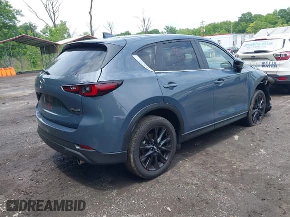 ✅ 2023 Mazda CX-5 S Carbon Edition • VIN: JM3KFBCM8P0223695 • Lot: 42379352. Listed on IAAI with 41,849 mi. Free auction sales archive from the USA and detailed vehicle history report at DreamBid. Image 4.