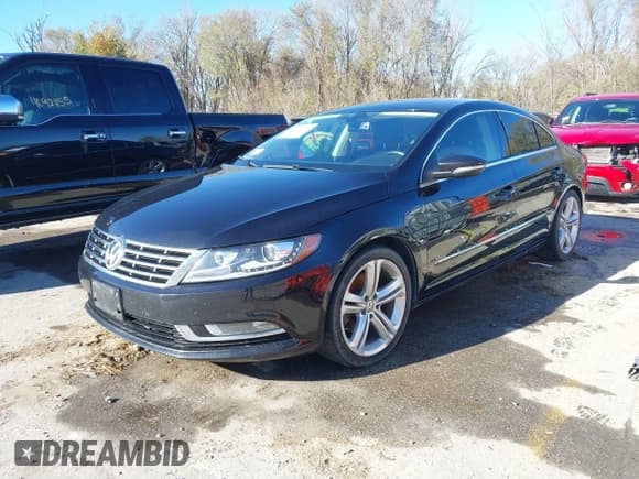 ✅ 2013 Volkswagen CC R-Line • VIN: WVWBP7AN1DE500863 • Lot: 40929279. Listed on IAAI with 150,379 mi. Free auction sales archive from the USA and detailed vehicle history report at DreamBid. Image 2.
