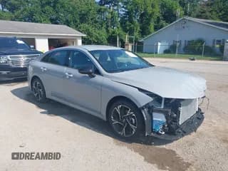 ✅ 2025 Kia K5 GT-Line • VIN: KNAG64J70S5314797 • Lot: 42665519. Listed on IAAI with 6,008 mi. Free auction sales archive from the USA and detailed vehicle history report at DreamBid. Image 1.