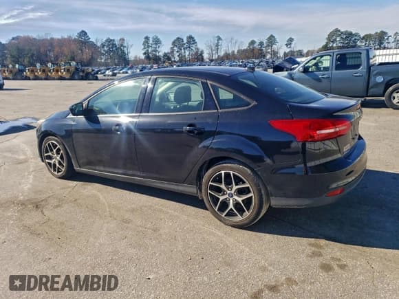 ✅ 2018 Ford Focus SE • VIN: 1FADP3FE5JL318977 • Lot: 94295725. Listed on Copart with 102,727 mi. Free auction sales archive from the USA and detailed vehicle history report at DreamBid. Image 2.