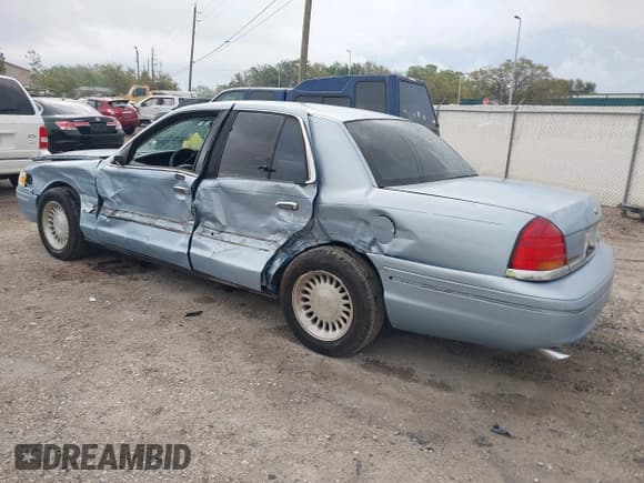 ✅ 1999 Ford Crown Victoria • VIN: 2FAFP73WXXX221069 • Lot: 41750127. Listed on IAAI with 177,142 mi. Free auction sales archive from the USA and detailed vehicle history report at DreamBid. Image 3.
