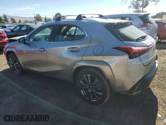 ✅ 2022 Lexus UX 250h F Sport • VIN: JTHE9JBH2N2062143 • Лот: 77345634. Опубликован ранее на Copart с пробегом 13 118 миль. Бесплатный доступ к архиву аукционных продаж из США и подробный отчёт об истории автомобиля на DreamBid. Изображение 2.