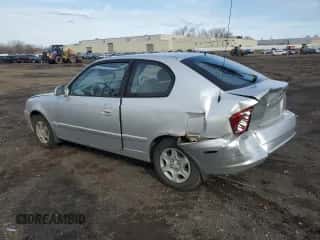 2005 Hyundai Accent GLS with VIN KMHCG35C05U343447, listed as a Copart auction lot 50418275 with 145,843 mi miles and Salvage title. Bid and sale history available at DreamBid. Image 2.