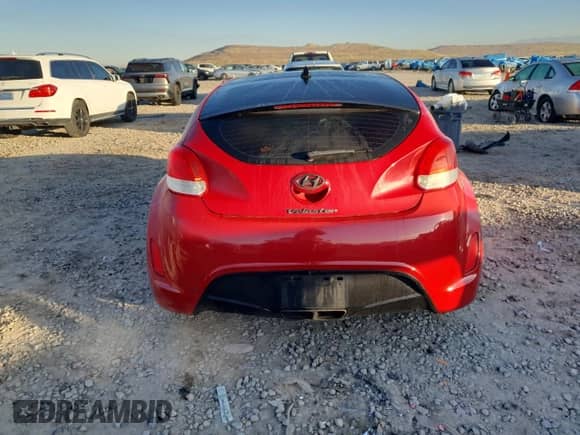 2012 Hyundai Veloster w/Red Int z VIN KMHTC6AD5CU067498, wystawiony jako Copart lot #90810075 z przebiegiem 132 773 mil mil oraz Czysty tytuł • Clean title. Historia ofert i sprzedaży dostępna na DreamBid. Obrazek 6.