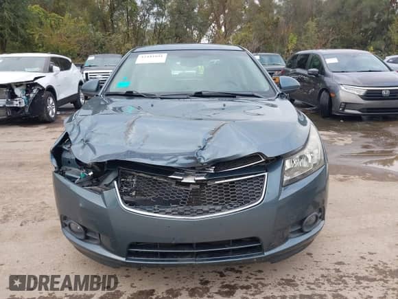 2012 Chevrolet Cruze 1LT z VIN 1G1PF5SC5C7240568, wystawiony jako IAAI lot #43441891 z przebiegiem 100 950 mil mil oraz . Historia ofert i sprzedaży dostępna na DreamBid. Obrazek 12.