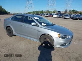 ✅ 2015 Mitsubishi Lancer SE • VIN: JA32V2FW8FU018621 • Lot: 43043895. Listed on IAAI with 64,616 mi. Free auction sales archive from the USA and detailed vehicle history report at DreamBid. Image 1.