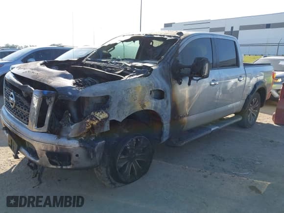 ✅ 2017 Nissan Titan Pro-4X • VIN: 1N6AA1E50HN570801 • Lot: 43453590. Listed on IAAI with Not provided. Free auction sales archive from the USA and detailed vehicle history report at DreamBid. Image 2.