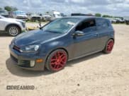 ✅ 2012 Volkswagen Golf GTI w/Conv & Sunroof • VIN: WVWEV7AJ8CW125885 • Lot: 61879735. Listed on Copart with 88,406 mi. Free auction sales archive from the USA and detailed vehicle history report at DreamBid. Image 1.