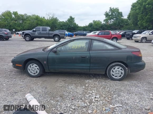 ✅ 1997 Saturn SC • VIN: 1G8ZF1285VZ100218 • Лот: 42881895. Опубликован ранее на IAAI с пробегом 114 002 миль. Бесплатный доступ к архиву аукционных продаж из США и подробный отчёт об истории автомобиля на DreamBid. Изображение 14.