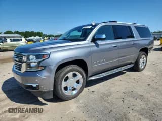 ✅ 2020 Chevrolet Suburban Premier • VIN: 1GNSCJKC3LR283529 • Lot: 60967375. Wystawiony na Copart z przebiegiem 142 043 mil. Bezpłatny archiwum sprzedaży aukcyjnych z USA i szczegółowy raport historii pojazdu na DreamBid. Zdjęcie 1.