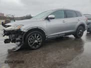 ✅ 2014 Mazda CX-9 Grand Touring • VIN: JM3TB2DA7E0441970 • Lot: 93404105. Wystawiony na Copart z przebiegiem 147 437 mil. Bezpłatny archiwum sprzedaży aukcyjnych z USA i szczegółowy raport historii pojazdu na DreamBid. Zdjęcie 1.