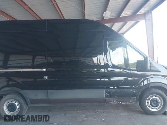 ✅ 2021 Ford Transit Cargo • VIN: 1FTBR3XG8MKA89703 • Lot: 42885214. Listed on IAAI with 79,907 mi. Free auction sales archive from the USA and detailed vehicle history report at DreamBid. Image 14.