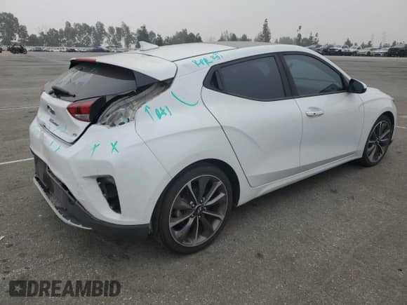 2020 Hyundai Veloster 2.0 z VIN KMHTG6AF6LU027629, wystawiony jako Copart lot #76408204 z przebiegiem 74 849 mil mil oraz Szkoda całkowita • Salvage title. Historia ofert i sprzedaży dostępna na DreamBid. Obrazek 3.
