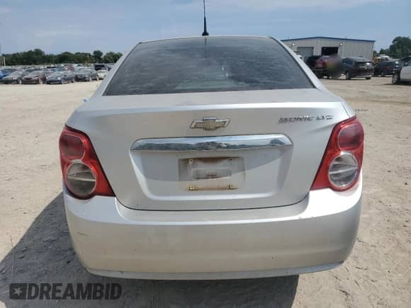 2012 Chevrolet Sonic LTZ с VIN 1G1JE5SH8C4108328, выставлен на аукционе Copart как лот 80509915 с пробегом 111 625 миль миль и Списание • Salvage title. История ставок и продаж доступна на DreamBid. Изображение 6.