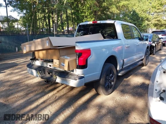 ✅ 2023 Ford F-150 Lightning Pro • VIN: 1FT6W1EV3PWG54808 • Lot: 43036931. Listed on IAAI with 42,398 mi. Free auction sales archive from the USA and detailed vehicle history report at DreamBid. Image 4.