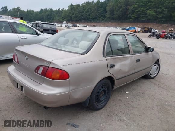 ✅ 1999 Toyota Corolla VE • VIN: 2T1BR12E2XC142458 • Lot: 42879723. Listed on IAAI with 140,141 mi. Free auction sales archive from the USA and detailed vehicle history report at DreamBid. Image 4.