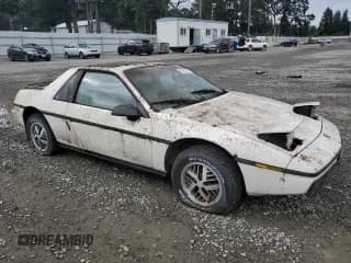 ✅ 1984 Pontiac Fiero • VIN: 1G2AF37R6EP320306 • Lot: 68255394. Wystawiony na Copart z przebiegiem 49 284 mil. Bezpłatny archiwum sprzedaży aukcyjnych z USA i szczegółowy raport historii pojazdu na DreamBid. Zdjęcie 4.