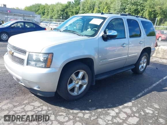 2011 Chevrolet Tahoe LTZ with VIN 1GNSKCE01BR231833, listed as a IAAI auction lot 43053303 with 247,341 mi miles and . Bid and sale history available at DreamBid. Image 17.