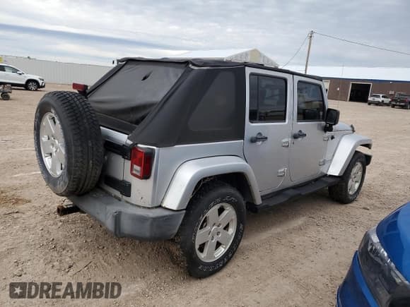 ✅ 2007 Jeep Wrangler Unlimited Sahara • VIN: 1J4GA59167L212909 • Lot: 82455775. Listed on Copart with 124,148 mi. Free auction sales archive from the USA and detailed vehicle history report at DreamBid. Image 3.
