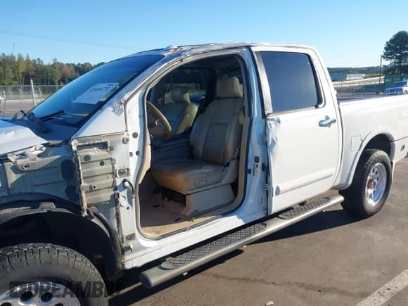 ✅ 2009 Nissan Titan LE • VIN: 1N6BA07D79N318614 • Lot: 43460475. Listed on IAAI with 232,157 mi. Free auction sales archive from the USA and detailed vehicle history report at DreamBid. Image 18.