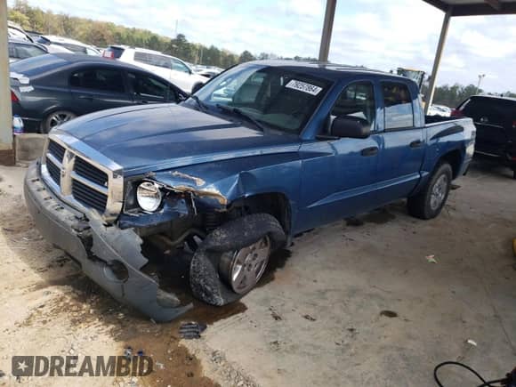 2005 Dodge Dakota SLT with VIN 1D7HW48N85S112443, listed as a Copart auction lot 79257864 with 194,022 mi miles and Salvage title. Bid and sale history available at DreamBid. Image 1.