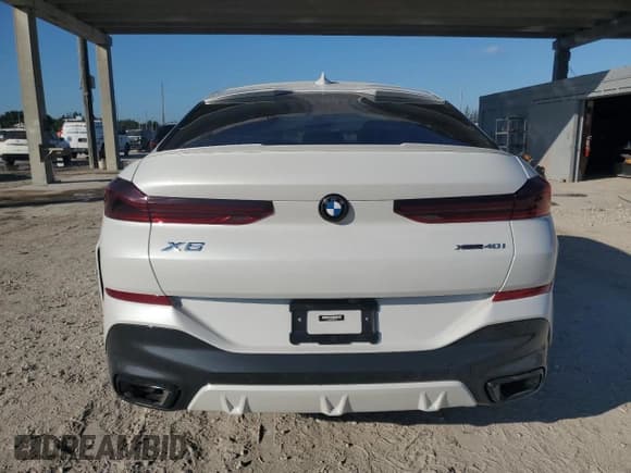 ✅ 2023 BMW X6 xDrive40i • VIN: 5UXCY6C03P9R77741 • Лот: 90633015. Опубликован ранее на Copart с пробегом 10 889 миль. Бесплатный доступ к архиву аукционных продаж из США и подробный отчёт об истории автомобиля на DreamBid. Изображение 6.