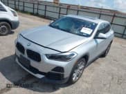 ✅ 2022 BMW X2 xDrive28i • VIN: WBXYJ1C08N5U39736 • Lot: 43077448. Listed on IAAI with 21,444 mi. Free auction sales archive from the USA and detailed vehicle history report at DreamBid. Image 18.
