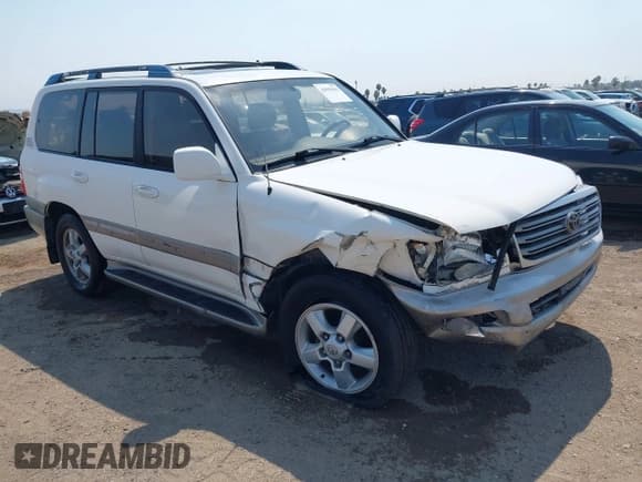 ✅ 2003 Toyota Land Cruiser • VIN: JTEHT05J732046635 • Lot: 42999962. Listed on IAAI with 263,143 mi. Free auction sales archive from the USA and detailed vehicle history report at DreamBid. Image 1.