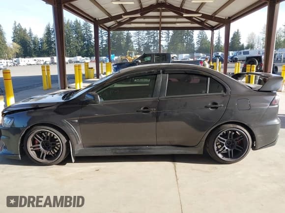 ✅ 2011 Mitsubishi Lancer Evolution MR • VIN: JA32W5FV3BU037240 • Lot: 42024710. Listed on IAAI with 98,386 mi. Free auction sales archive from the USA and detailed vehicle history report at DreamBid. Image 14.