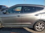 ✅ 2014 Hyundai Santa Fe • VIN: 5XYZW3LAXEG140795 • Лот: 43650491. Опубликован ранее на IAAI с пробегом 166 910 миль. Бесплатный доступ к архиву аукционных продаж из США и подробный отчёт об истории автомобиля на DreamBid. Изображение 14.