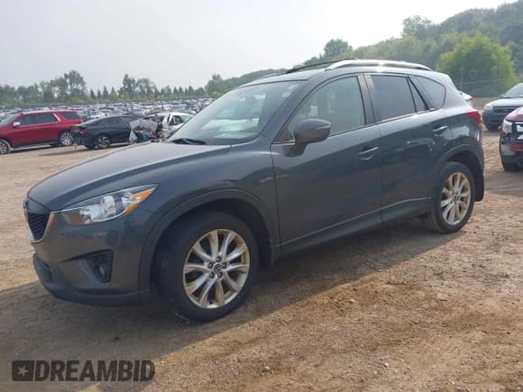 ✅ 2015 Mazda CX-5 Grand Touring • VIN: JM3KE2DY9F0482490 • Lot: 42910659. Wystawiony na IAAI z przebiegiem 121 949 mil. Bezpłatny archiwum sprzedaży aukcyjnych z USA i szczegółowy raport historii pojazdu na DreamBid. Zdjęcie 2.