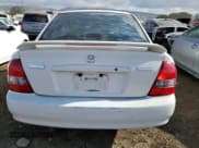 ✅ 2000 Mazda Protege DX • VIN: JM1BJ222XY0250079 • Lot: 77715474. Wystawiony na Copart z przebiegiem 139 214 mil. Bezpłatny archiwum sprzedaży aukcyjnych z USA i szczegółowy raport historii pojazdu na DreamBid. Zdjęcie 6.