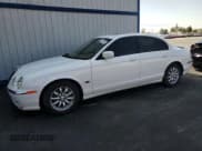 ✅ 2002 Jaguar S-Type • VIN: SAJDA01P92GM29630 • Лот: 62421225. Опубликован ранее на Copart с пробегом 75 686 миль. Бесплатный доступ к архиву аукционных продаж из США и подробный отчёт об истории автомобиля на DreamBid. Изображение 1.