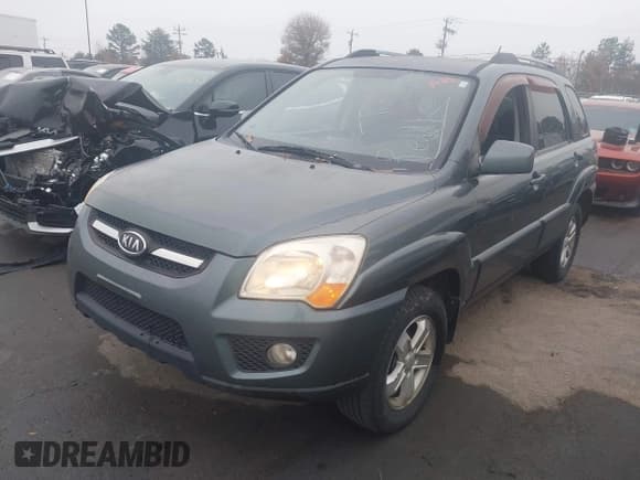 ✅ 2009 Kia Sportage EX • VIN: KNDJF723197573772 • Лот: 43764392. Опубликован ранее на IAAI с пробегом 158 611 миль. Бесплатный доступ к архиву аукционных продаж из США и подробный отчёт об истории автомобиля на DreamBid. Изображение 2.