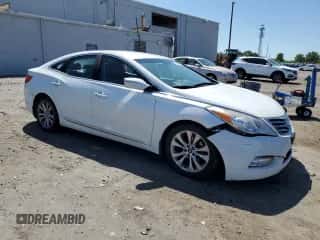 2013 Hyundai Azera z VIN KMHFG4JG4DA223002, wystawiony jako Copart lot #54886085 z przebiegiem 164 125 mil mil oraz Czysty tytuł • Clean title. Historia ofert i sprzedaży dostępna na DreamBid. Obrazek 4.