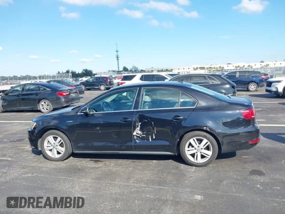 ✅ 2014 Volkswagen Jetta Hybrid • VIN: 3VW637AJ3EM219456 • Lot: 43745704. Listed on IAAI with 105,295 mi. Free auction sales archive from the USA and detailed vehicle history report at DreamBid. Image 14.