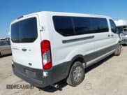 ✅ 2023 Ford Transit Passenger XLT • VIN: 1FBAX2Y88PKA93648 • Lot: 43637916. Listed on IAAI with 42,318 mi. Free auction sales archive from the USA and detailed vehicle history report at DreamBid. Image 4.
