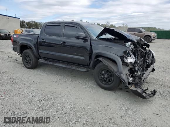 ✅ 2023 Toyota Tacoma SR5 • VIN: 3TYAZ5CN8PT031801 • Lot: 86067835. Listed on Copart with 27,793 mi. Free auction sales archive from the USA and detailed vehicle history report at DreamBid. Image 4.