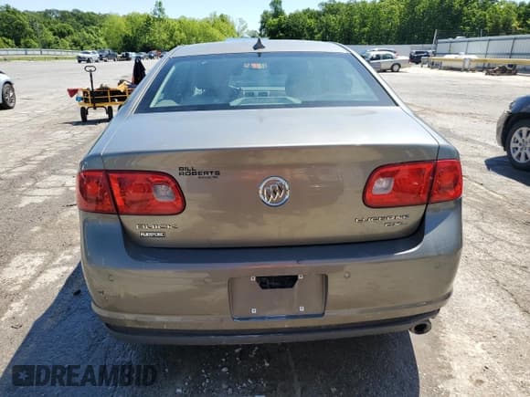 ✅ 2010 Buick Lucerne CXL-3 • VIN: 1G4HE5EM1AU119565 • Лот: 59899645. Опубликован ранее на Copart с пробегом 186 667 миль. Бесплатный доступ к архиву аукционных продаж из США и подробный отчёт об истории автомобиля на DreamBid. Изображение 6.