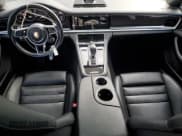 ✅ 2018 Porsche Panamera 4 E-Hybrid • VIN: WP0AE2A70JL128154 • Лот: 83802565. Опубликован ранее на Copart с пробегом 80 459 миль. Бесплатный доступ к архиву аукционных продаж из США и подробный отчёт об истории автомобиля на DreamBid. Изображение 8.