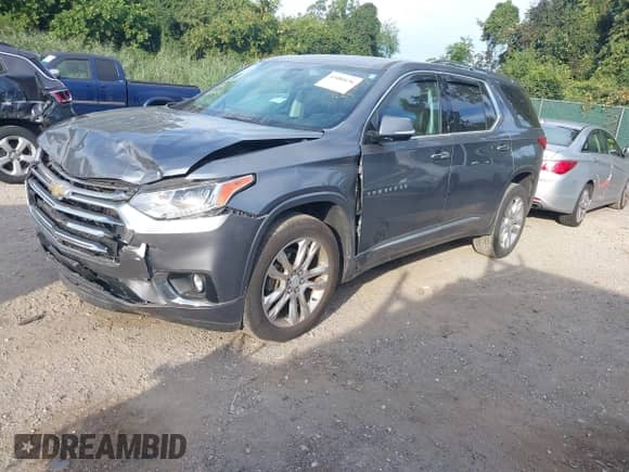 2020 Chevrolet Traverse High Country with VIN 1GNEVNKW4LJ154397, listed as a IAAI auction lot 43080136 with 68,754 mi miles and . Bid and sale history available at DreamBid. Image 2.