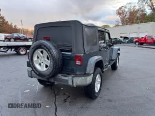 ✅ 2007 Jeep Wrangler Unlimited X • VIN: 1J8GA39177L144753 • Лот: 90586105. Опубликован ранее на Copart с пробегом 171 270 миль. Бесплатный доступ к архиву аукционных продаж из США и подробный отчёт об истории автомобиля на DreamBid. Изображение 3.