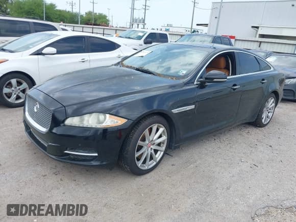 ✅ 2014 Jaguar XJ • VIN: SAJWA1CZ9E8V60522 • Лот: 41919728. Опубликован ранее на IAAI с пробегом 122 184 миль. Бесплатный доступ к архиву аукционных продаж из США и подробный отчёт об истории автомобиля на DreamBid. Изображение 2.