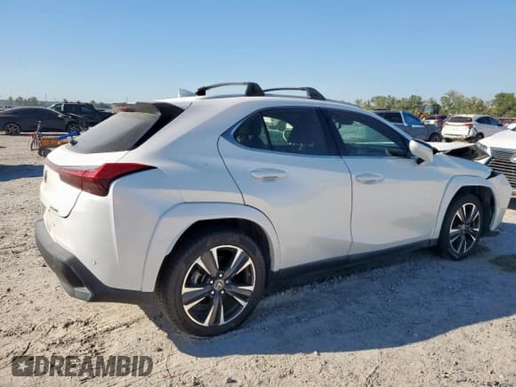 ✅ 2022 Lexus UX 200 • VIN: JTHP3JBH3N2046320 • Лот: 82411005. Опубликован ранее на Copart с пробегом 54 675 миль. Бесплатный доступ к архиву аукционных продаж из США и подробный отчёт об истории автомобиля на DreamBid. Изображение 3.