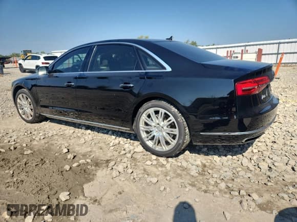 ✅ 2015 Audi A8 4.0T • VIN: WAU32AFD8FN037989 • Лот: 71414795. Опубликован ранее на Copart с пробегом 98 189 миль. Бесплатный доступ к архиву аукционных продаж из США и подробный отчёт об истории автомобиля на DreamBid. Изображение 2.