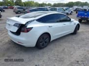 ✅ 2021 Tesla Model 3 Standard Range Plus • VIN: 5YJ3E1EA6MF052276 • Lot: 43164101. Listed on IAAI with 26,101 mi. Free auction sales archive from the USA and detailed vehicle history report at DreamBid. Image 4.