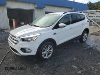 2018 Ford Escape SE с VIN 1FMCU9GDXJUC76982, выставлен на аукционе Copart как лот 87299125 с пробегом 88 151 миль миль и Чистый • Clean title. История ставок и продаж доступна на DreamBid. Изображение 1.