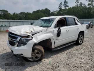 2019 Chevrolet Tahoe LS with VIN 1GNSCAKC9KR151048, listed as a Copart auction lot 69196595 with 100,702 mi miles and Salvage title. Bid and sale history available at DreamBid. Image 1.